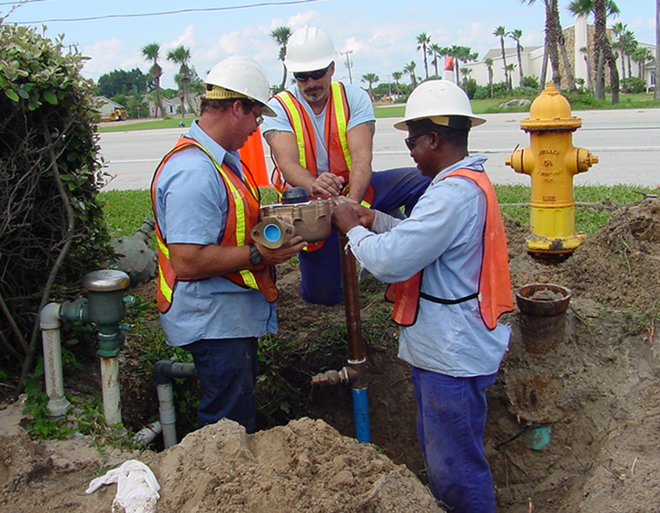 Water distribution crew works on a water line.