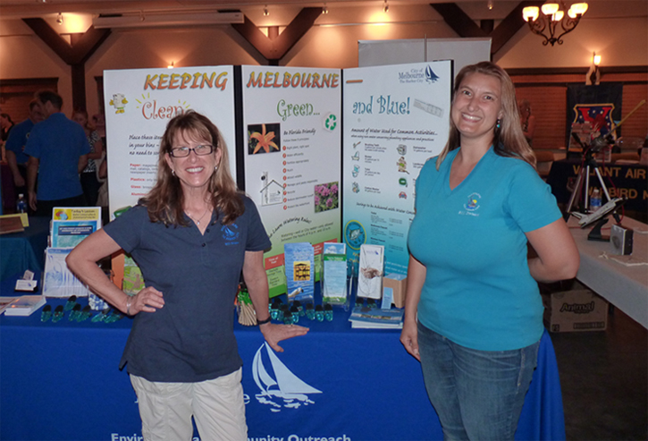 Environmental Community Outreach staff man an exhibit booth where they hand out information about water conservation