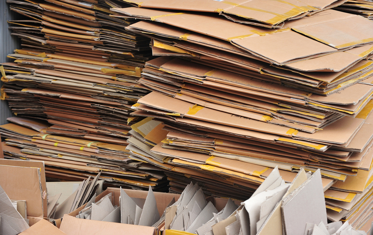 Pile of flattened cardboard boxes.