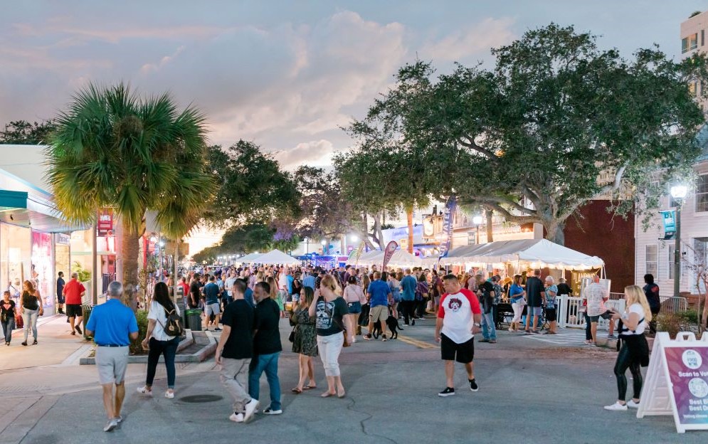 New Haven Avenue full of pedestrians walking by and visiting outdoor booths during the Downtown Melbourne Food and Wine Festival 2022. Image courtesy Melbourne Main Street