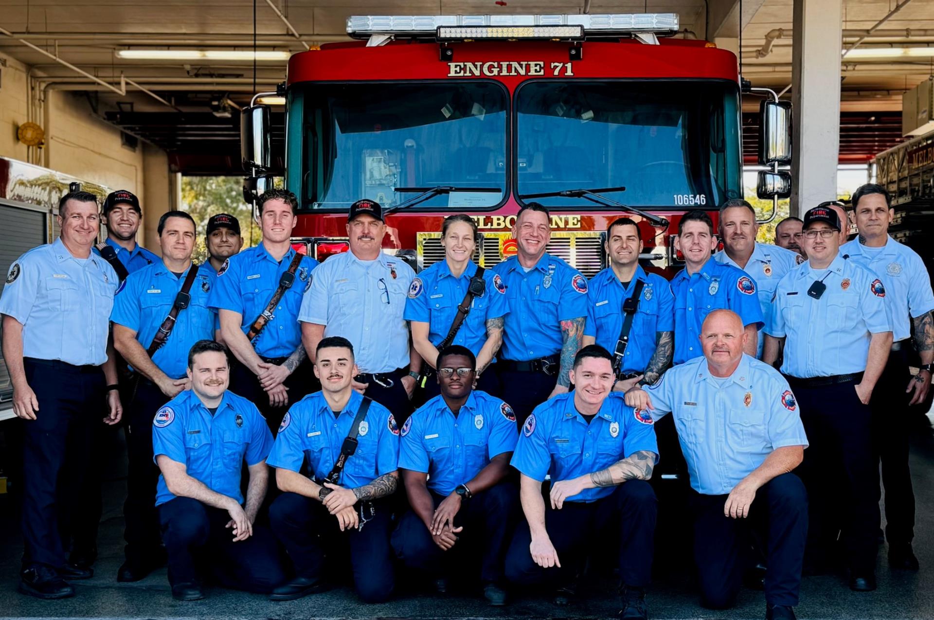 Group of firefighters in front of Engine 71