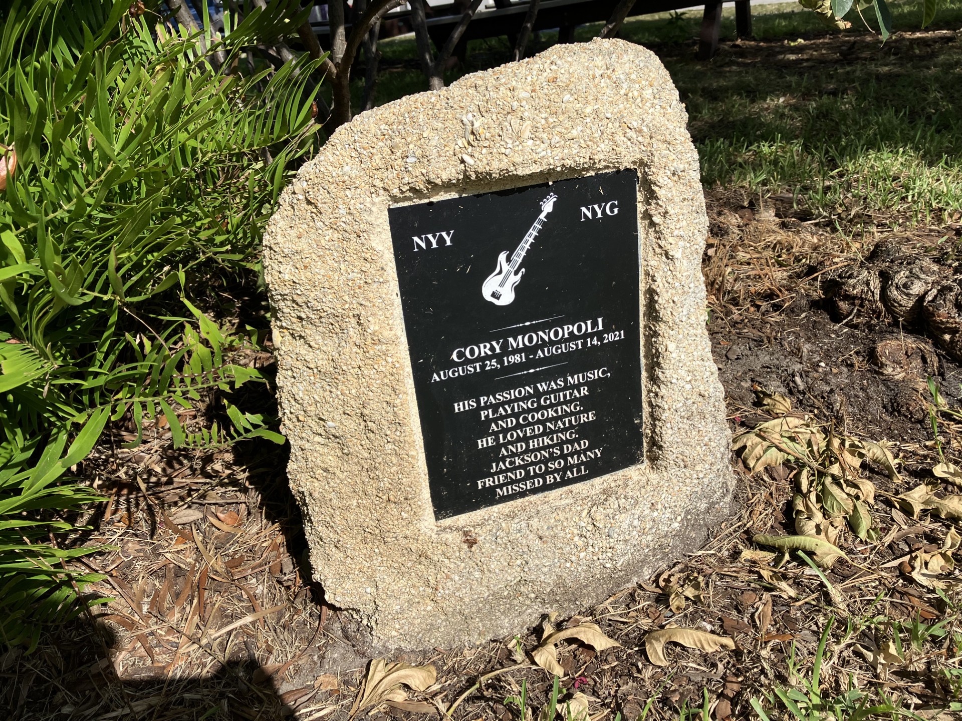 Close up view of memorial plaque on a coquina stone