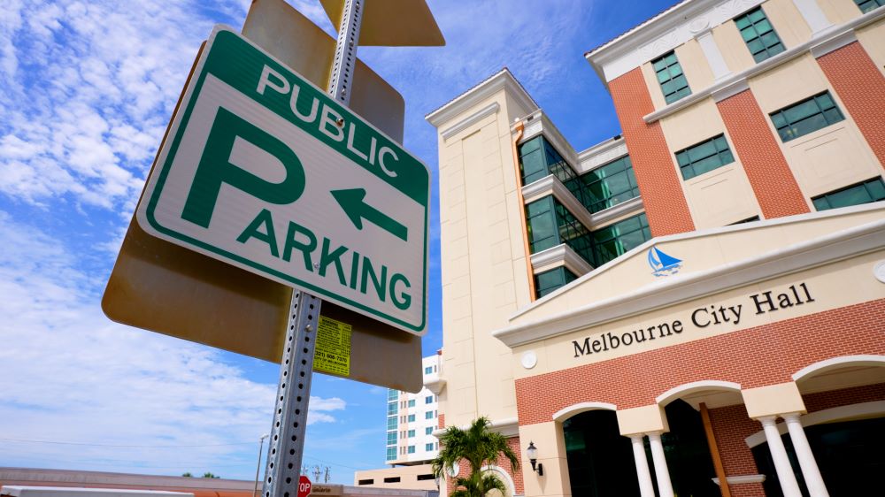 Sign in front of City Hall that says Public Parking