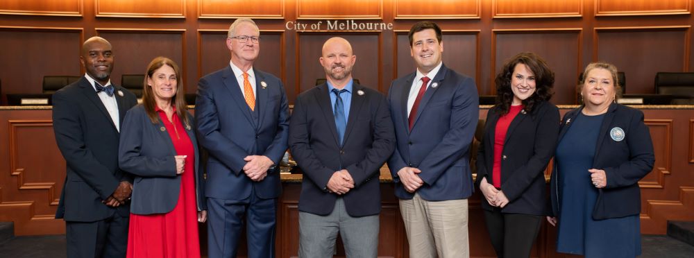 Group picture of City Council members in the Council Chamber