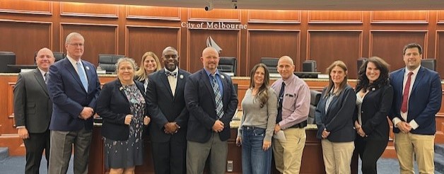 Council members and Wolfgang Kermer in the Council Chamber for Service Awards presentation