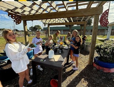 Gemini Elementary students making salads in their garden