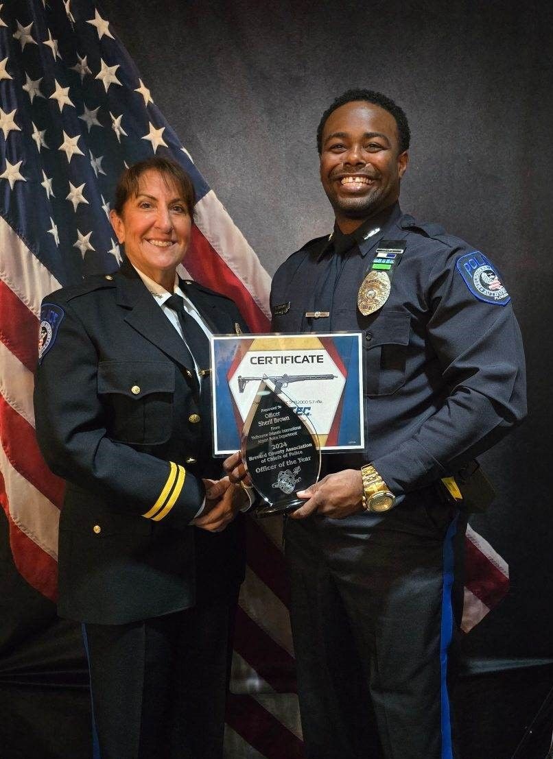 MAPD Chief Renee Purden and MAPD Officer Sherif Brown with his award